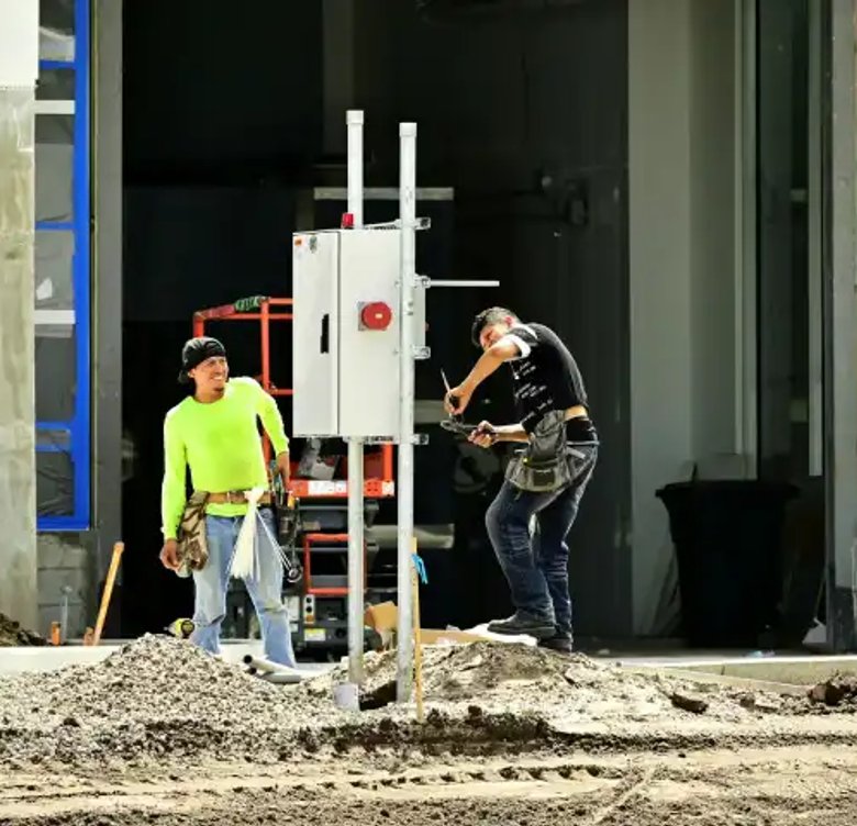 Photo of men on construction site